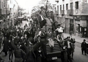 Jews crowd onto a British army armoured car as they celebrate in downtown Jerusalem the morning after the United Nations voted on November 29, 1947 to partition Palestine which paved the way for the creation of the State of Israel on May 15, 1948. . (photo credit:REUTERS)