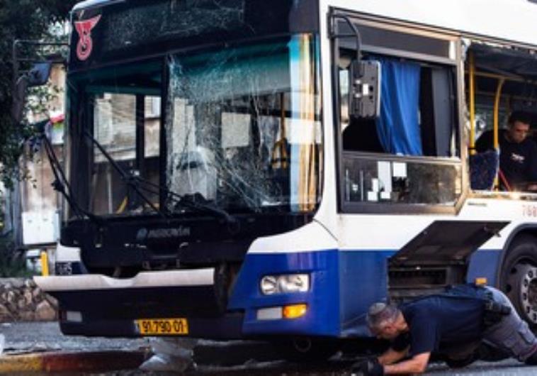 Police bomb experts at the scene of the attempt terrorist attack in Bat Yam, December 22, 2013. Bat Yam bus bombing 370. (photo credit:REUTERS/Nir Elias)