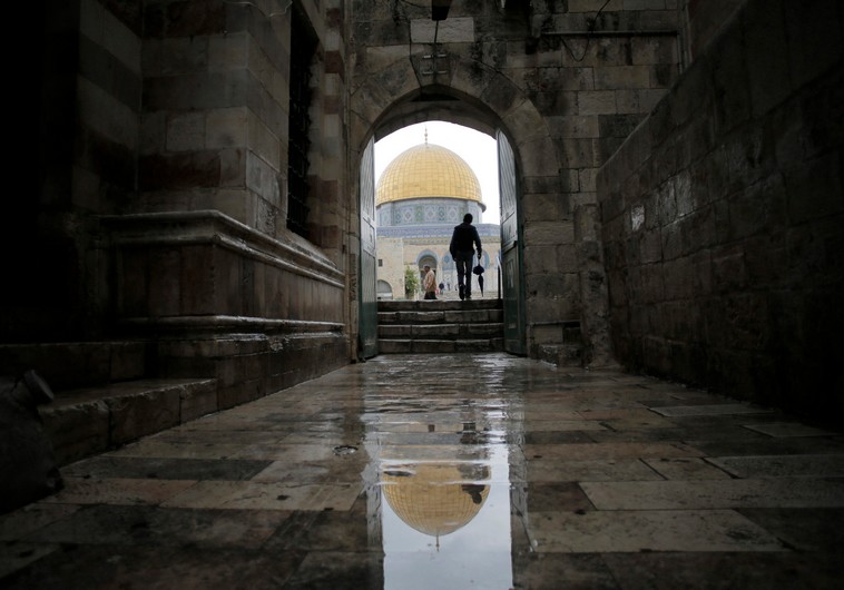 A visitor walks toward the Dome of the Rock as he enters the compound known to Muslims as Noble Sanctuary and to Jews as Temple Mount, in Jerusalem's Old City. (photo credit:REUTERS)