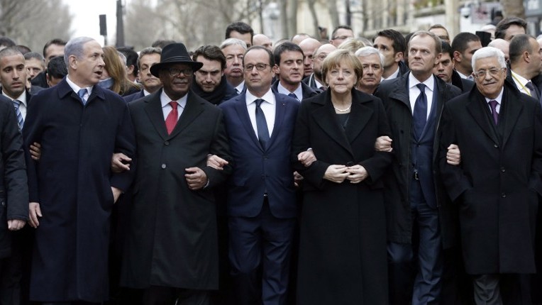 French President Francois Hollande (3rd from left) is surrounded by heads of state (from left to right) Prime Minister Benjamin Netanyahu, Ibrahim Boubakar Keita of Mali, Chancellor Angela Merkel of Germany, EU Council President Donald Tusk and Palestinian Authority President Mahmoud Abbas as they attend the solidarity march (March Republicaine) in the streets of Paris, January 11, 2015. (photo credit: AFP/Philippe Wojazer, Pool)