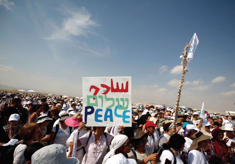Activists, including Israelis and Palestinians, take part in a demonstration in support of peace near Jericho. (photo credit:REUTERS)