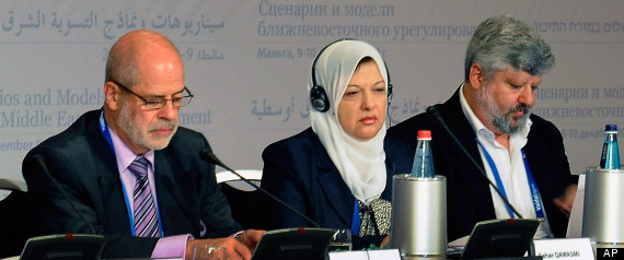 Palestinian MP Sahar Qawasmi, center, is flanked by Vitaly Naumkin, director of the Center for Arab Studies at the Institute of Oriental Studies, Russian Academy of Sciences, at left, and Gershon Baskin, Israeli Co-Director and founder of the Israel/Palestine Center for Research and Information International conference, at right, as they attend the first day of the international summit “Scenarios and Models of the Middle East Peace Settlement”, in La Valletta, Malta, Thursday, Dec. 9, 2010. (AP Photo/Lino Arrigo Azzopardi)