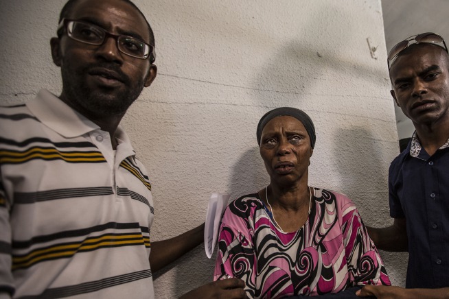 The mother of Avraham Mengistu, 28, weeps during a family press conference, at the costal city of Ashkelon, Israel, Thursday, July 9, 2015. An Israeli security official said Thursday the Hamas militant group has been holding Mengistu in the Gaza Strip for nearly a year. The Israeli defense body responsible for Palestinian civilian affairs, said Mengistu, born in 1986 from the Israeli city of Ashkelon, independently crossed the border fence into the Gaza Strip in September last year, nearly two weeks after the end of the Israel-Gaza war. (AP Photo/Tsafrir Abayov) (Tsafrir Abayov/AP)