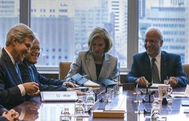 Israeli and Palestinian negotiating teams sit with US Secretary of Kerry in New York, Sept 27, 2013. Photo: REUTERS/Brendan McDermid