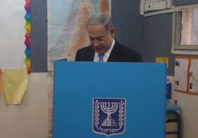 Prime Minister Benjamin Netanyahu votes in national election, March 17, 2015. (photo credit:MARC ISRAEL SELLEM)