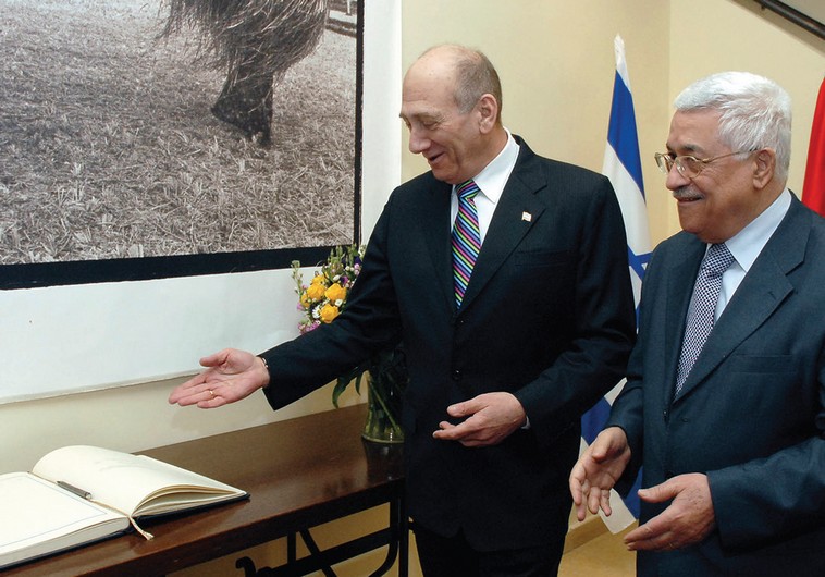 THEN-PRIME Minister Ehud Olmert stands with Palestinian President Mahmoud Abbas during their meeting in Jerusalem in January, 2008. (photo credit:REUTERS)