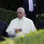 Pope Francis is flanked by Israel's President Shimon Peres (right) and Palestinian President Mahmoud Abbaas